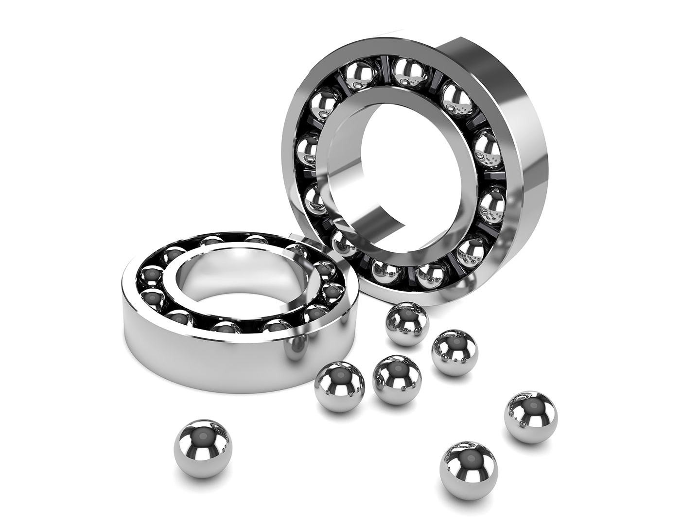 Close-up photo showing two disassembled or partially disassembled ball bearings and several loose balls.