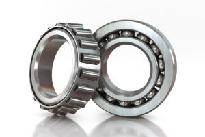 image shows a roller bearing and a ball bearing