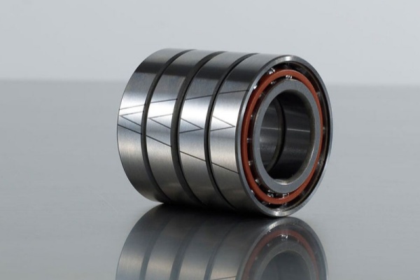 A close-up image of 4 high-precision angular contact bearings, with the Marks for Installation on the surface.