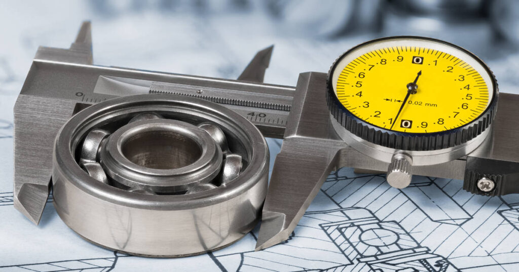 The image shows a ruler measuring bearing tolerance
