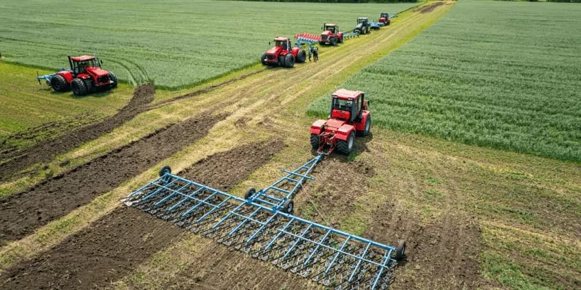 Cooperative staff operating multiple seeders and tillers equipped with TFL bearings in a field