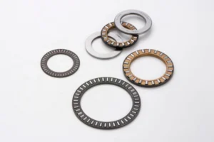 Close-up of a needle thrust bearing showcasing its long, thin needle rollers and cage design for compact, high-load applications.