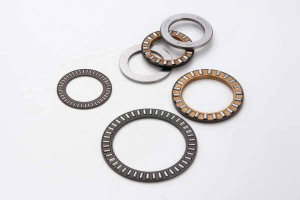 Close-up of a needle thrust bearing showcasing its long, thin needle rollers and cage design for compact, high-load applications.