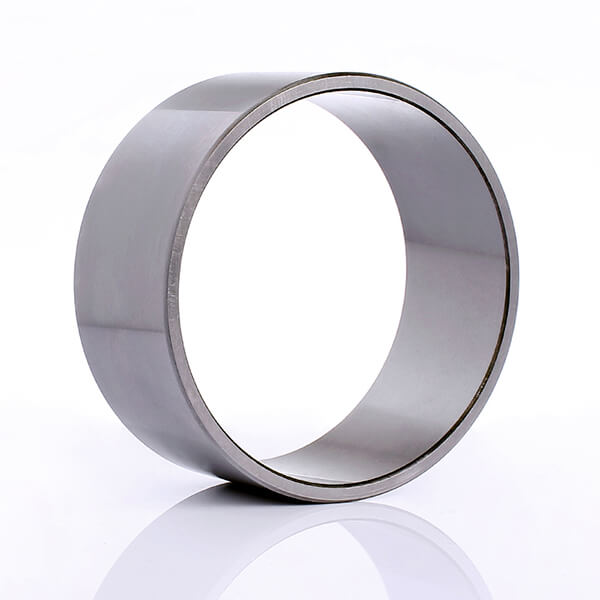 Close-up of a high-precision needle roller bearing inner ring showing its smooth, hardened surface.