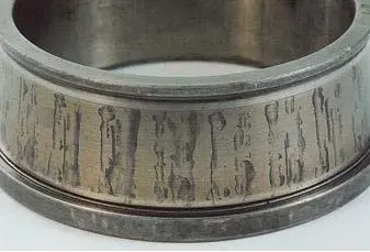 Some rust from water in lubricant on inner ring
