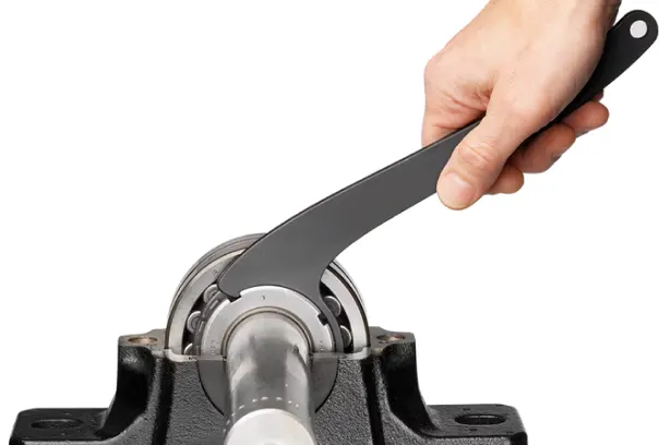 image shows a wrench that is installing a bearing