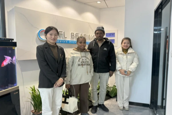 A picture shows a client and his translation assistant visiting our TFL company.