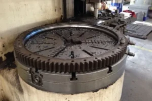 An image of an industrial slewing bearing showing discoloration and metal shavings.