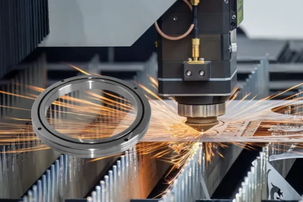 A close-up view of an RA crossed roller bearing installed in a high precision machine, showing how its ultra-thin profile integrates seamlessly into the compact design.