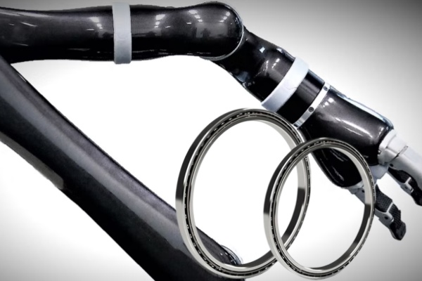 A robotic arm utilizing thin section bearings for reduced weight and compact design.