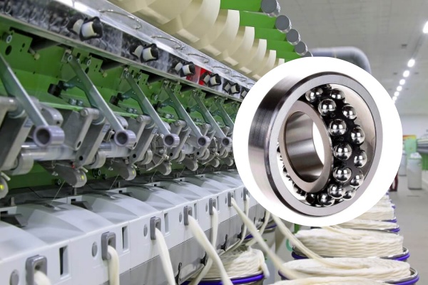 Production line utilizing self-aligning ball bearings for long shaft support.