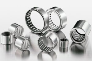 An assortment of SDTFL needle roller bearings displayed to show various sizes and configurations for compact systems.