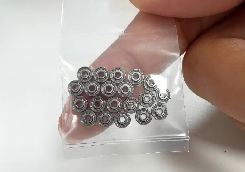 SRW0ZZ shielded miniature bearings shown during visual inspection before shipment