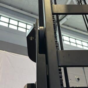 Forklift mast guide bearing installed inside the mast channel